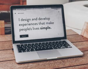 A laptop computer opened on a table. Web design
